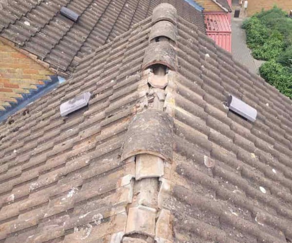 This is a photo if a roof ridge which has missing tiles. The ridge tiles are being replaced by KAM Roofing Askern